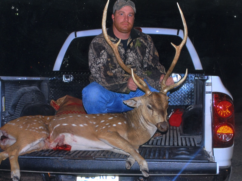 Hunter with a harvested buck, a J's Deer & Wild Game Processing customer in San Angelo, Texas